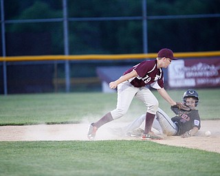 Boardman's Mason Nawrocki misses the throw from home as Canfield's Drew Snyder slides into second during the Little League baseball 11-U playoff game on Wednesday.