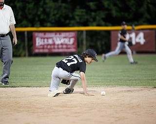 Canfield's Zain Jadallah reaches for the ball during the Little League baseball 11-U playoff game against Boardman on Wednesday.