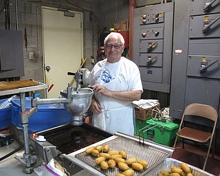 Neighbors | Zack Shively.St. John's Greek Orthodox Church had their annual food festival on May 24-27. The festival included a pastry room where the church sold many hand-made sweets. Pictured, George Zografides made loukoumathes, Greek honey puffs, for the festival.