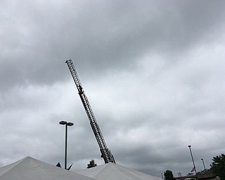 Neighbors | Submitted.Fire Chief Mark Pitzer climbed to the top of the Boardman Fire Department's tallest ladder truck on June 2 to raise funds for the memorial they are constructing at the new fire house. He collected $200 toward the memorial.