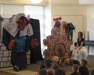 Neighbors | Zack Shively.The Madcap Puppets are a nonprofit group from Cincinnati. They perform various shows throughout the state and have more than 1,000 puppets to use. Many of their shows feature a large backpack puppet, such as The Crazy lady pictured. Actor Zach Robinson danced and sang while wearing the costume.