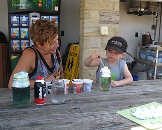 Neighbors | Zack Shively.Fellows Riverside Gardens hosted their weekly Family Fun Friday event on June 15 in the Family Garden. The program gives families a way to have fun together during the summer. Pictured, Evan Emmanuel made a cloud demonstration with the help of Linda Biggs.