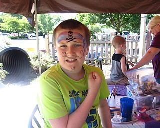 Neighbors | Zack Shively.The Family Fun Fridays event has different organizations in the Family Garden, such as Fantasy Face Painters at the event on June 24. Pictured, Nick Hird got his face painted at the event.