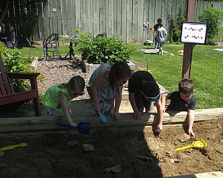 Neighbors | Zack Shively.Having the Family Fun Fridays event at the Family Garden in Fellows Riverside Garden allowed for the children to play with the equipment at the garden, such as a sandbox and playset. They also have their nature displays, such as the bee exhibit and plants in the garden. Pictured, Sawyer, Sophia, Vincent and Andrew played in the sandbox.