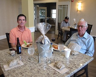 Neighbors | Zack Shively.The Inn at Poland Way's Father's Day event had approximately 65 attendees. The facility made the centerpieces for the event, which they raffled off to residents. The centerpieces had candy and treats inside. Pictured are Tom Philbin and his father Ben at the event, enjoying pizza.