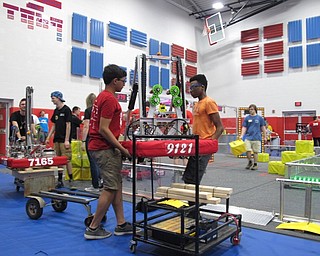 Neighbors | Jessica Harker.Members of the Sylvania STEM Center team carried their robot into the arena June 30 for the Austintown robotics tournament.
