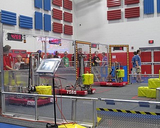 Neighbors | Jessica Harker.Three teams from the red alliance prepared to begin one of the rounds at the Austintown robotics tournament on June 30.