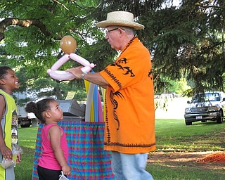 Neighbors | Jessica Harker.Jocko the Baloon man placed a princess crown on London Phifer, who attended the Boardman Family Night at the park on June 30 with her family.