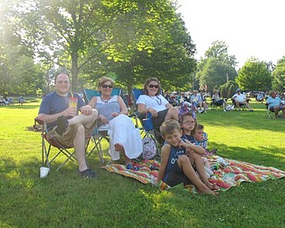 Neighbors | Jessica Harker.Josh Royalty, Diana Stivers and Jan Royalty sat and listened to the band play along with Josh and Jan's children, Connor, Allatha and Owen, during the Family Night at the park event on June 30.