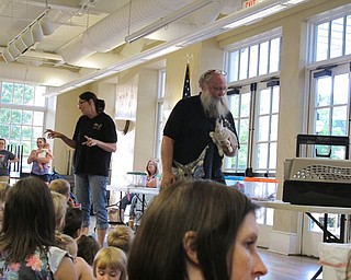 Neighbors | Jessica Harker.Beth and Dwayne Felger discuss the animals that they brought to the Poland library June 28.
