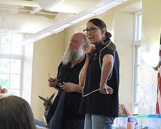 Neighbors | Jessica Harker.Dwayne and Beth Felger presented to the group of children gathered at the Poland library for the Felgers exotic animals event June 28.