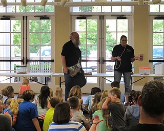 Neighbors | Jessica Harker.Dwayne and Beth Felger presented to the children gathered at the Poland library June 28 for the Felgers exotic animals event.