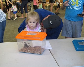 Neighbors | Jessica Harker.Children were allowed to look at, but not pet the rose haired teranchula at the Poland library June 28.