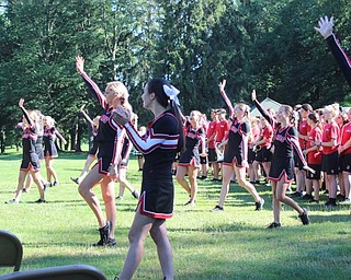 Neighbors | Abby Slanker.The Cardinal cheerleaders performed a spirit cheer for the large crowd at the Till Open Ceremony prior to the start of the golf outing on July 7.