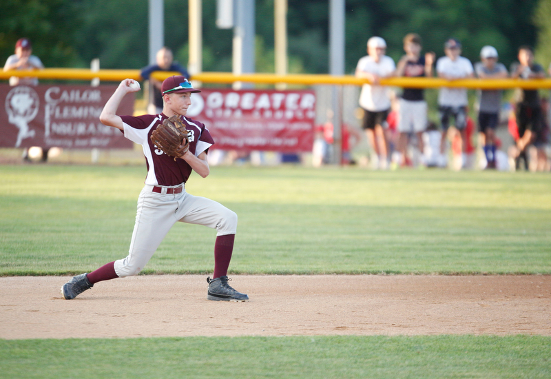 Boardman's Jack Ericson throws the ball to first during the first inning of the 12u district championship game against Poland at Field of Dreams in Boardman on Thursday.