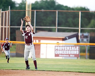 Boardman's Jack Ericson positions himself under a fly ball during the second inning of the 12u district championship game against Poland at Field of Dreams in Boardman on Thursday.