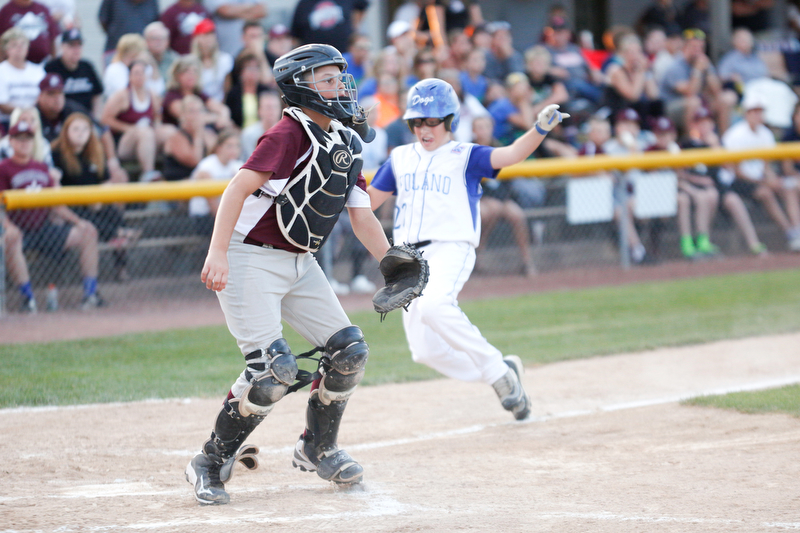 Boardman's Gavin Hyde waits for the ball as Poland's Michael Chambers slides into home during the 12u district championship game at Field of Dreams in Boardman on Thursday.