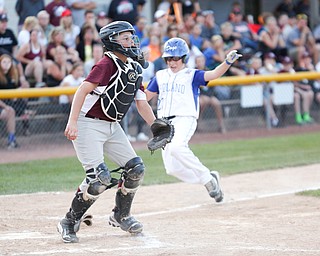 Boardman's Gavin Hyde waits for the ball as Poland's Michael Chambers slides into home during the 12u district championship game at Field of Dreams in Boardman on Thursday.