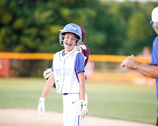 Poland's Danny Nitolli smiles after getting on first during the second inning of the 12u district championship game against Boardman at Field of Dreams in Boardman on Thursday.