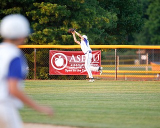 Poland's Danny Nitolli catches a ball in center field during the third inning of the 12u district championship game against Boardman at Field of Dreams in Boardman on Thursday.