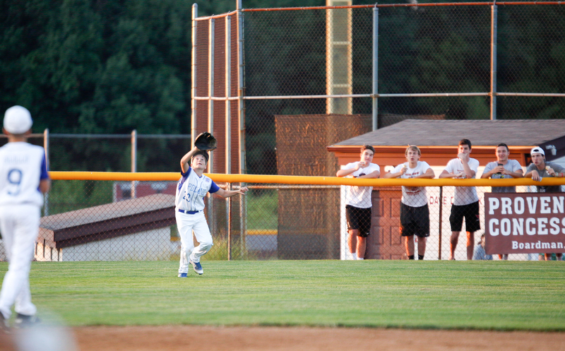 Poland's Dom Elia goes after a ball during the third inning of the 12u district championship game against Boardman at Field of Dreams in Boardman on Thursday.
