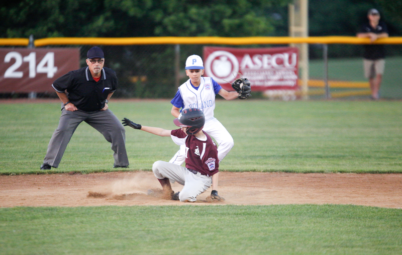 Boardman's Evan Sweder slides safely into second as Poland's Ryan DiLullo catches the ball during the fourth inning of the 12u district championship game at Field of Dreams in Boardman on Thursday.