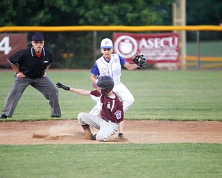 Boardman's Evan Sweder slides safely into second as Poland's Ryan DiLullo catches the ball during the fourth inning of the 12u district championship game at Field of Dreams in Boardman on Thursday.