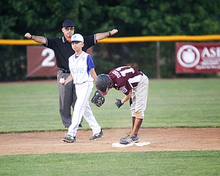 Boardman's Evan Sweder gets called safe at second after Poland's Ryan DiLullo tried to make a play during the fourth inning of the 12u district championship game at Field of Dreams in Boardman on Thursday.