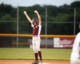 Boardman's Jack Ericson celebrates after getting to second during the fourth inning of the 12u district championship game against Poland at Field of Dreams in Boardman on Thursday.