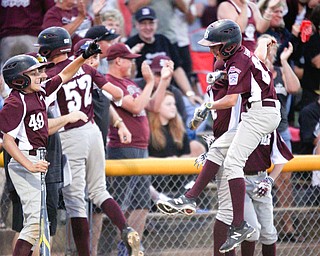 Boardman celebrates after getting ahead of Poland 4-2 in the fourth inning of the 12u district championship game at Field of Dreams in Boardman on Thursday.