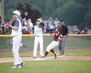 Boardman's Marty Stackowitz makes it to third while Poland's Ryan DiLulla waits for the ball during the 12u championship game at Field of Dreams on Friday.