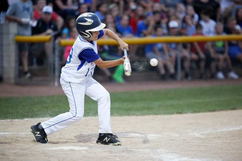 Poland's Paul Greco bunts the ball during the 12u championship game against Boardman at Field of Dreams on Friday.