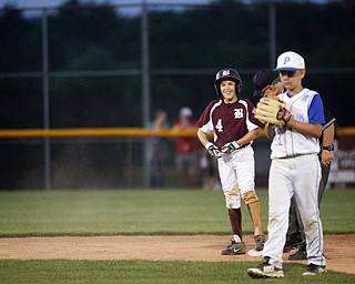 Boardman's Matt Kay smiles after making it to second during the 12u championship game against Poland at Field of Dreams on Friday.