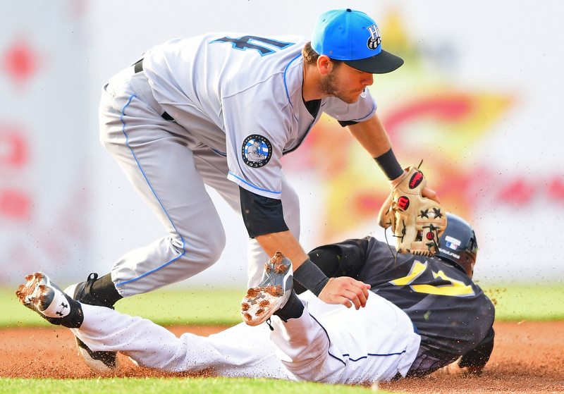 NILES, OHIO - JULY 14, 2018: Mahoning Valley Scrappers' Richard Palacios is tagged out by Chris Betts after attempting to steal first base in the first inning of a baseball game, Saturday, July 14, 2018, in Niles. Renegades won 1-0. DAVID DERMER | THE VINDICATOR