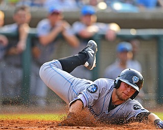 NILES, OHIO - JULY 14, 2018: Hudson Valley Renegades' Erik Ostberg slides across home plate to score a run on a RBI-single by Jake Stone in the second inning of a baseball game against the Mahoning Valley Scrappers, Saturday, July 14, 2018, in Niles. Renegades won 1-0. DAVID DERMER | THE VINDICATOR