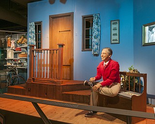 This image provided by the Senator John Heinz History Center in Pittsburgh shows a set from the old PBS children's television show "Mister Rogers' Neighborhood," including a model of host Fred Rogers tying his trademark sneakers as he did at the start of every episode. The Heinz History Center is part of the Fred Rogers Trail being promoted by Pennsylvania tourism officials on the 50th anniversary of the show's 1968 launch. A new documentary called "Won't You Be My Neighbor?" has also rekindled interest in Rogers' legacy. (Senator John Heinz History Center via AP)