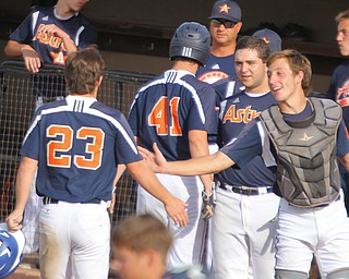 WilliamD. Lewis The Vindicator  Astros catcher Connor Millergives congrts to Chase Franken(23) and Ricky Havrilla(41) after they scored  during 7-17-18 game with Baird at Cene.