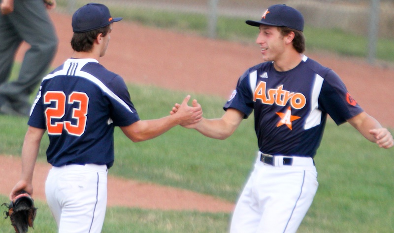 Astro Falcons pitcher Chase Franken (23) and Connor Miller, right, celebrate a 14-1 victory over Baird Brothers in a decisive Game 5 of the Class B 16-U championship series on Tuesday at Bob Cene Park in Struthers.