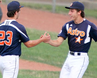 Astro Falcons pitcher Chase Franken (23) and Connor Miller, right, celebrate a 14-1 victory over Baird Brothers in a decisive Game 5 of the Class B 16-U championship series on Tuesday at Bob Cene Park in Struthers.