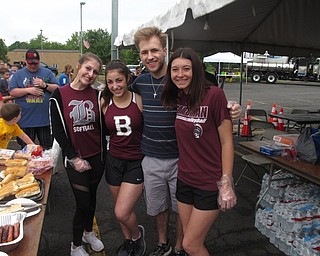 Neighbors | Zack Shively.Boardman's Community Day featured free food sponsored by Aqua Ohio. They had hot dogs, chips and water. The high school's National Honors Society students passed out the food to the Boardman residents. Pictured are, from left, NHS students Lauren Commarata, Ava Colaluca, Colin Russell and Carina Cummings.