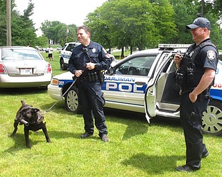 Neighbors | Zack Shively.As well as animal adoption possibilities and treats, Sweeney Chevrolet and Boardman Park organized special prizes games and a demonstration from the local K9 unit to show how the unit works. Pictured are Boardman polica officer Darren Tallman and his K9 Sumo, along with Poland police officer J.R. Jackson.