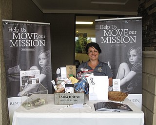 Neighbors | Zack Shively.The first Mission Night Market occurred on June 8 at Huntington Place Plaza. The market included local vendors, who bought tents for space to sell. A portion of the money made through the tents went toward the Rescue Mission of the Mahoning Valley. Pictured is Crystal Eckman, the mission ambassador, at the event.