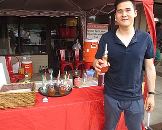 Neighbors | Zack Shively.The Mission Night Market featured 26 local vendors. Christian Rinehart, the organizer of the event as well as the owner of Mission Taco and Suzie's Dogs and Drafts, said he wanted to help the vendors and artisians develop their products. In the future, Rinehart wants to have the events in multiple locations. The market occurs the second Friday of each month until October at Huntington Place Plaza. Rinehart plans to incorporate local music and expand the event by October. Pictured is Chao Feng, a bubble tea seller at the event.