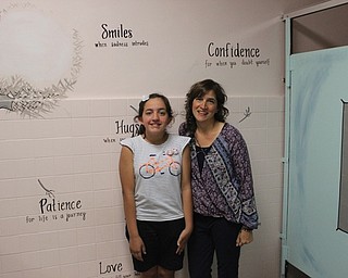 Neighbors | Abby Slanker.On June 7, Sam Nappo and her daughter, Canfield Village Middle School fifth-grade student Nina, visited Nappo’s favorite bathroom at the school after she was honored by students and staff for painting and improving several bathrooms throughout the school.