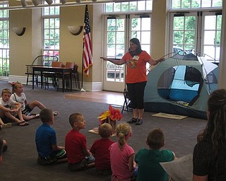Neighbors | Jessica Harker .Poland librarian Karen sung a song with the children in attendence at the Camp Out at the Library event on June 22.