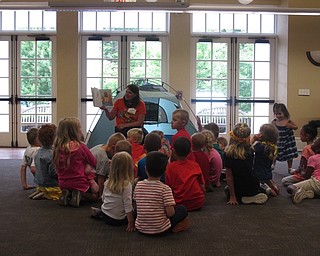 Neighbors | Jessica Harker .Poland librarian Karen read "Camp Rex" to the crowd of children on June 22.