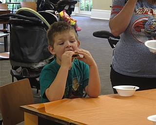 Neighbors | Jessica Harker .Brayden Albrecht, age 6, enjoyed a smore at the Poland Camp Out at the Library event June 22.