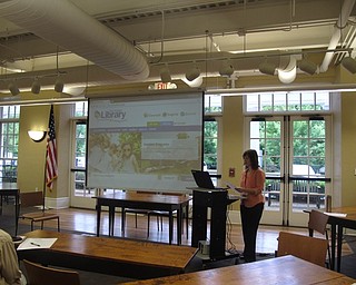 Neighbors | Jessica Harker .Poland librarian Katie demonstrates different sections of the library home page on June 19 during the learn the library website event.