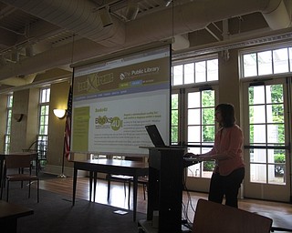Neighbors | Jessica Harker .Poland librarian Katie demonstrates the teen section on the library home page on June 19 during the learn the library website event.