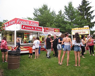 Neighbors | Jessica Harker.Various vendors were set up selling food to long lines of people on July 2 at Boardman Park's fireworks event.